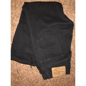 Calvin Klein black jeans, cut off!